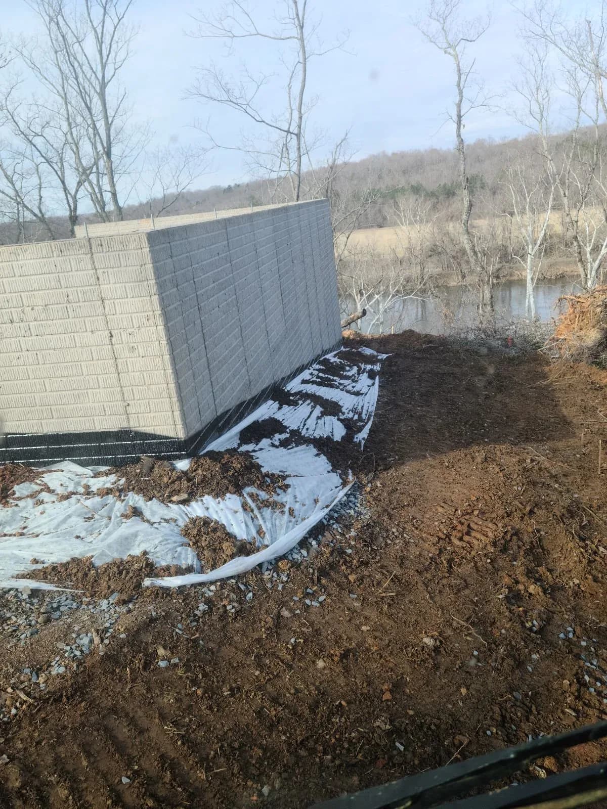 Drain tile installation at a foundation footer in Fluvanna County, Virginia